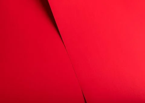 Red abstract paper background with a sharp diagonal fold. Minimal texture and Stock Photos