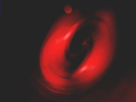 Red Abstract Vortex Swirl With Motion Blur And Dark Circular Light Energy P.. Illustrazione stock