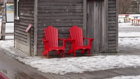 Red Adirondack Chairs in Winter by Rustic Wooden Cabin Stock Footage 271198105