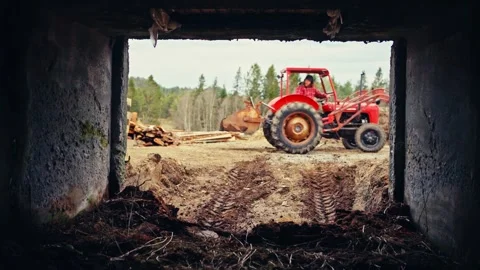 Red Agricultural Tractor with Front-End Loader in Forestry Area - Norway Video stock 344954981