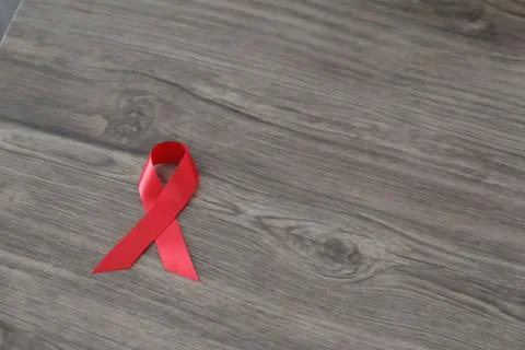 Red AIDS awareness ribbon. World aids day and healthcare and medicine concept Stock Photos