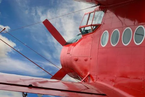 Red airplane biplane with piston engine Stock Photos