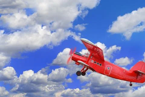 Red airplane biplane with piston engine Stock Photos