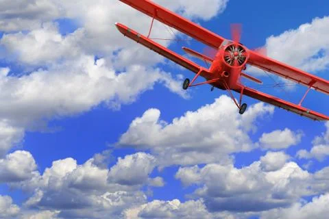 Red airplane biplane with piston engine Stock Photos