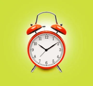 Red alarm clock isolated on yellow Stock-Fotos