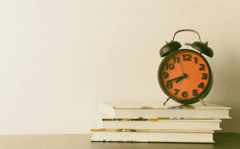Red Alarm clock on office table Stock Photos
