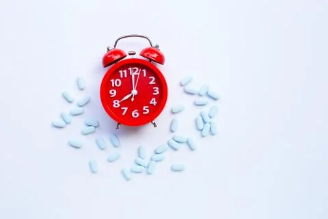 Red alarm clock ring with "PrEP"  used to prevent HIV. Stock Photos