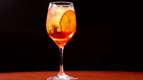 Red alcoholic drink with lemon Stock Footage 130453399