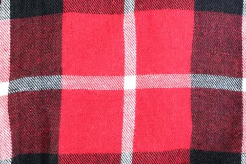 Red and black checkered pattern on fabric. Stock Photos