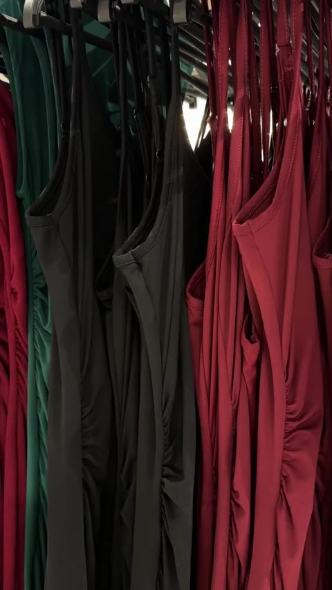 Red And Black Dresses Hanging Together On Fashion Store Rack Stock Footage 344977643