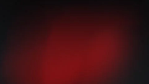 Red and black gradient backdrop with grain texture. Seamless loop background. Vidéo 309058794