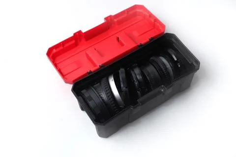 Red and black mini tool box isolated on white background, open position Stock Photos