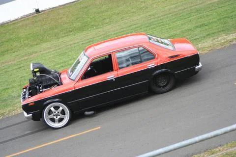 Red and black modified Drag Racing car with large powerful engine Stock Photos