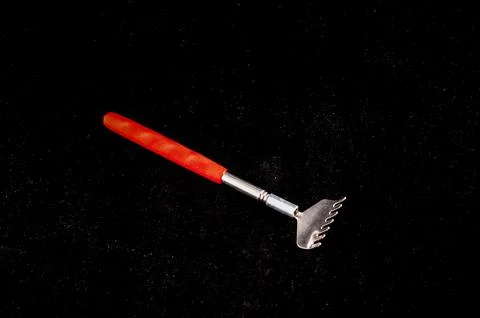 A red and black object with a pointed end Stock Photos