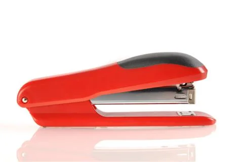 Red and black stapler isolated with reflection Stock Illustration