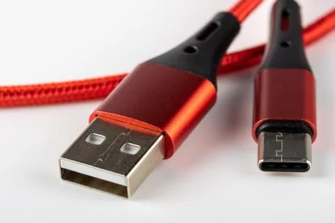Red and black USB Type C Type A connectors with red cable closeup Foto stock
