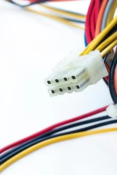 Red and black wire tangled with white connector on isolated background Stock Photos