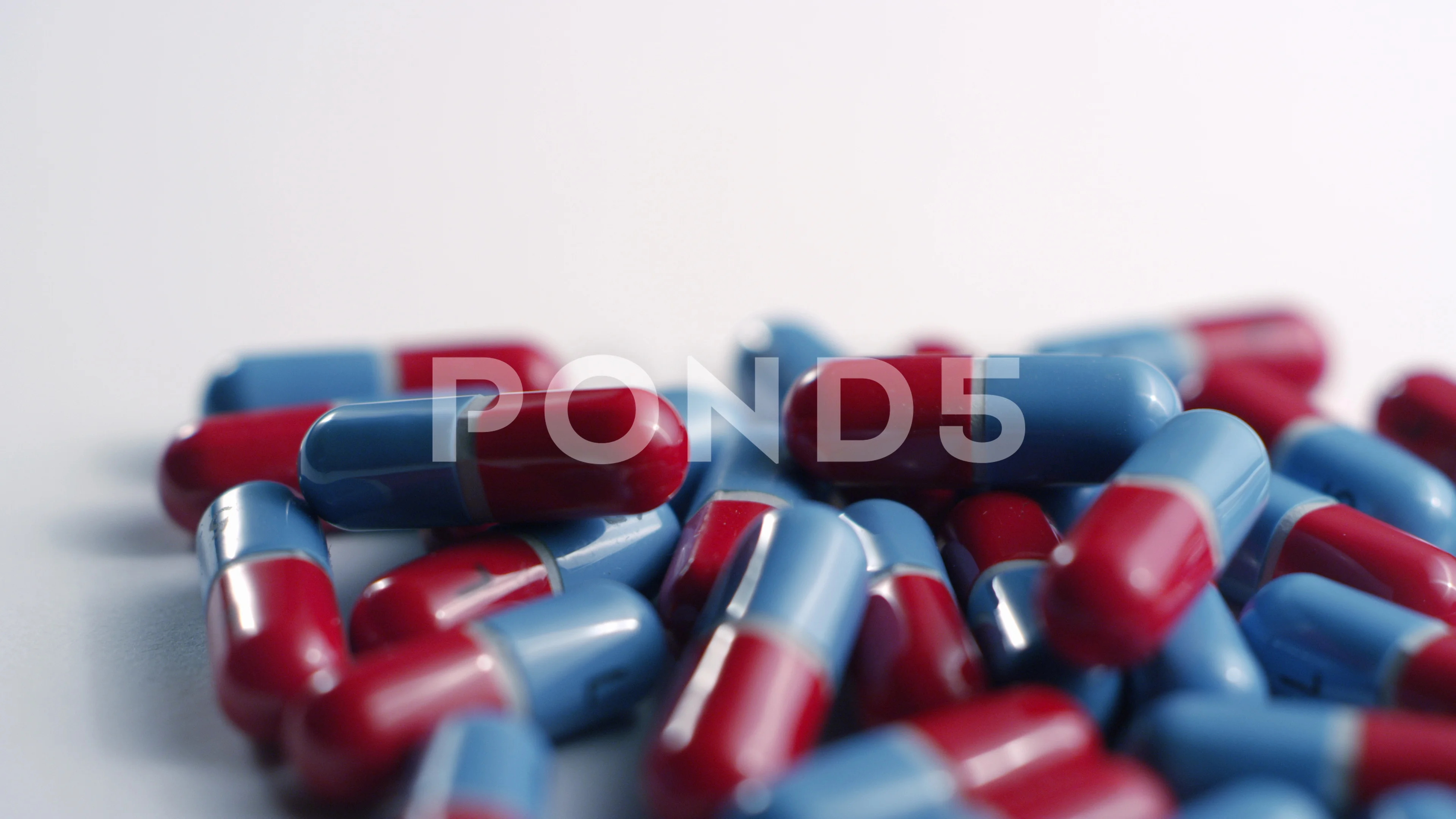 Red and blue acetaminophen capsule Video | Pond5