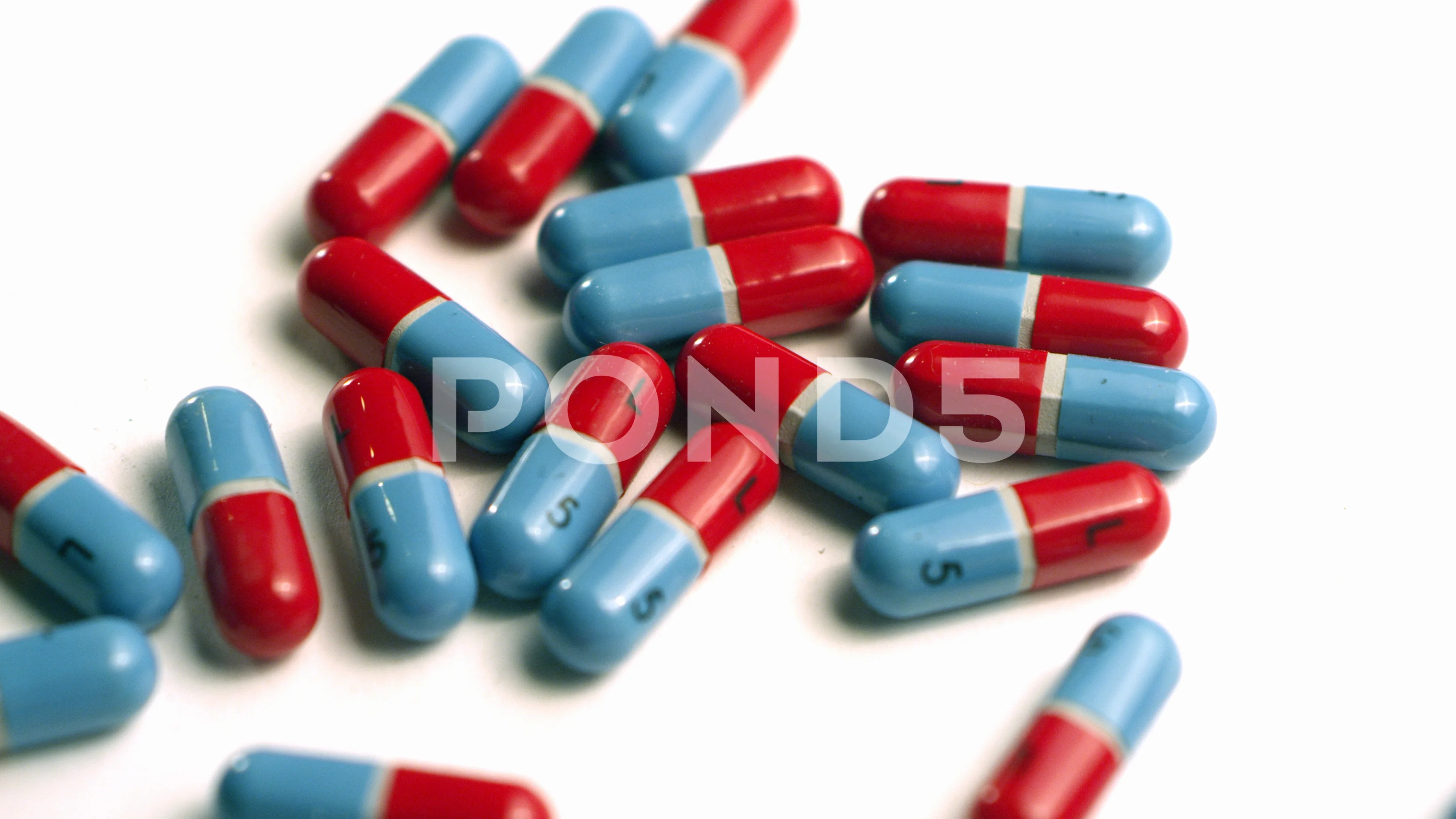 Red and blue acetaminophen capsule pills... Stock Video | Pond5
