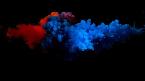 Red and blue colored paint cloud mixing underwater and on a black background. Stock Footage 115991334