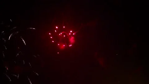 Red and blue fireworks exploding Stock-Footage 86933868