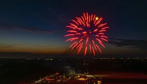 Red And Blue Fireworks Exploding In The Night Sky, Forming Brilliant Bursts Stock Photos