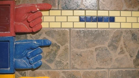 Red and blue hand pointers on the wall Video stock 121241230