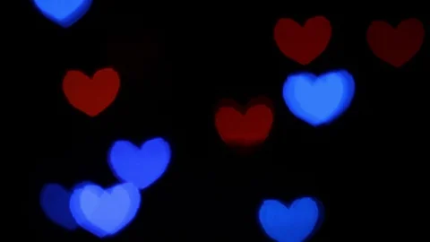 Red and blue hearts shape lights bokeh or blurred lights tilting Stock Footage 129179126