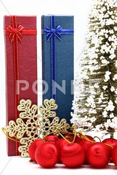 Red and blue holiday box with christmas tree and ornament Stock Photos