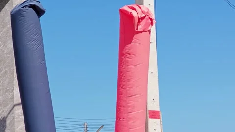 Red and blue inflatable doll blowing in the wind Stock Footage 305371168