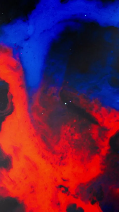 Red and Blue Ink Clouds Swirling in Dark Liquid Creating Cosmic Abstract Stock Footage 340882800
