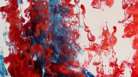 Red and blue ink in water against white, clouds of color Stock Footage