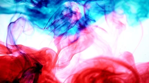 Red and blue ink in water.Creative slow motion. On a white background. Abstract Stock Footage