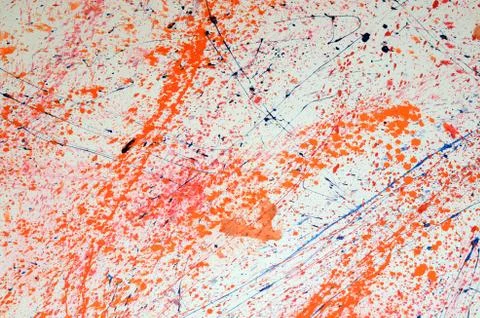 Red and blue paint splashes on grunge wall. Abstract hand painted backdrop for Stock Photos