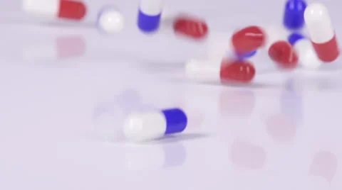 Red and Blue Pills Bouncing in Slo-Motion 動画素材 45917904
