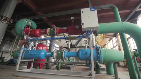 Red and blue pipes for transporting hot and cold water Stock Footage 247060244