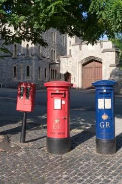 Red and blue postboxes and stamp machine, Windsor, Berkshire, England, United Stock Photos