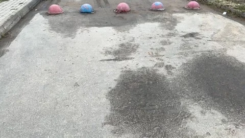 Red and blue restrictive hemispheres on the asphalt road in the parking area of Stock Footage 300053518