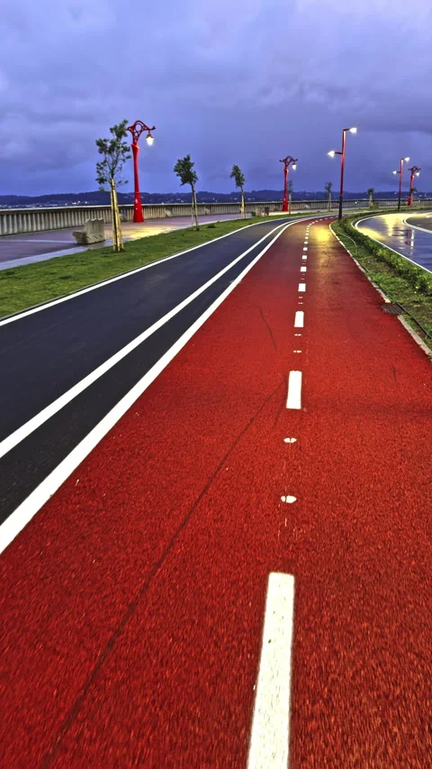 Red and Blue Road Under Stormy Skies Stock Footage 276332030
