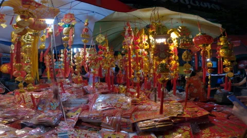 Red and gilded decorations at New Year market. Video stock 168579560