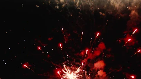 Red And Gold Fireworks Exploding In Night Sky Magical Celebration Leaving Video stock 327545451