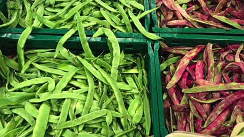 Red and green bean pods on display at a farm store, concept of harvest. Stock Footage 324101081