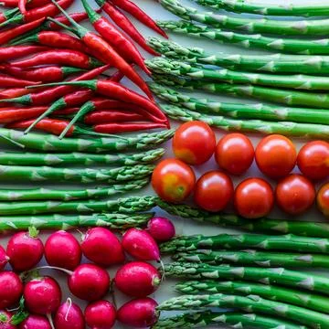 A red and green checkered pattern of fresh veggies. Stock Photos