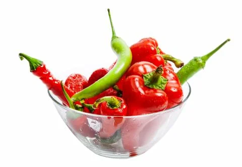 Red and green chili and bulgarian pepper in glass dish isolated on white Stock Photos