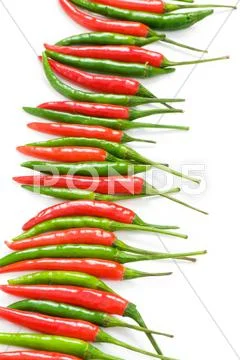 Red and green chili peppers isolated on the white Stock Photos