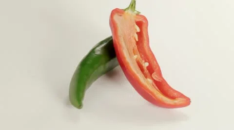 Red and green chilli sliced open Stock Footage 12693997