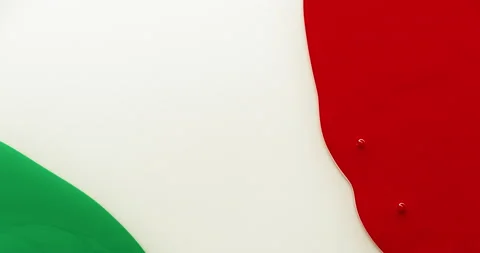 Red and green colored ink moving towards the center. Italy flag liquid colors Stock Footage 136303093