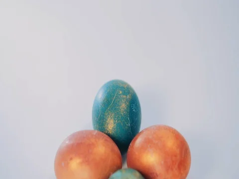 Red and green Easter eggs on white background. Dolly shot Stock Footage 73804245