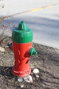 Red and green fire hydrant Stock Photos