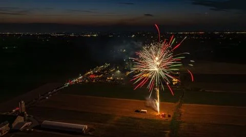 Red And Green Fireworks Exploding In The Night Sky, Creating Vibrant Bursts.. Stock Photos